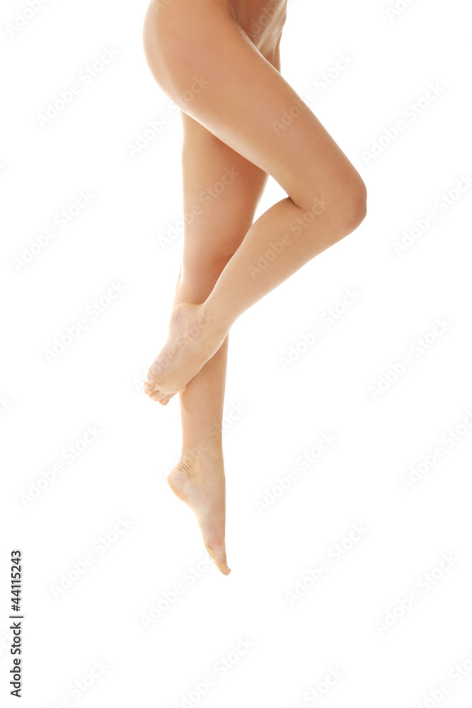 Flexed naked long legs of woman. Flexed naked long legs of woman.