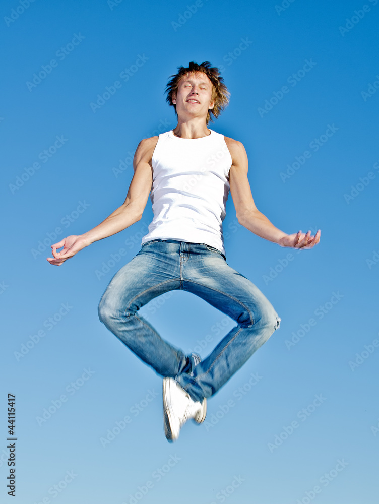 Man meditating in yoga lotus pose in the sky Man meditating in yoga lotus pose in the sky