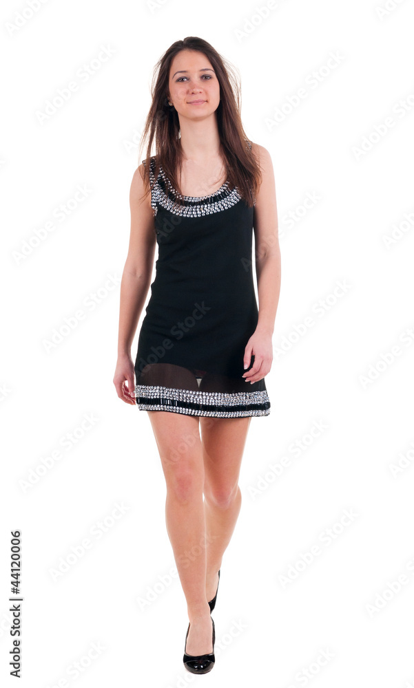 walking beautiful brunette woman in black dress. walking beautiful brunette woman in black dress.