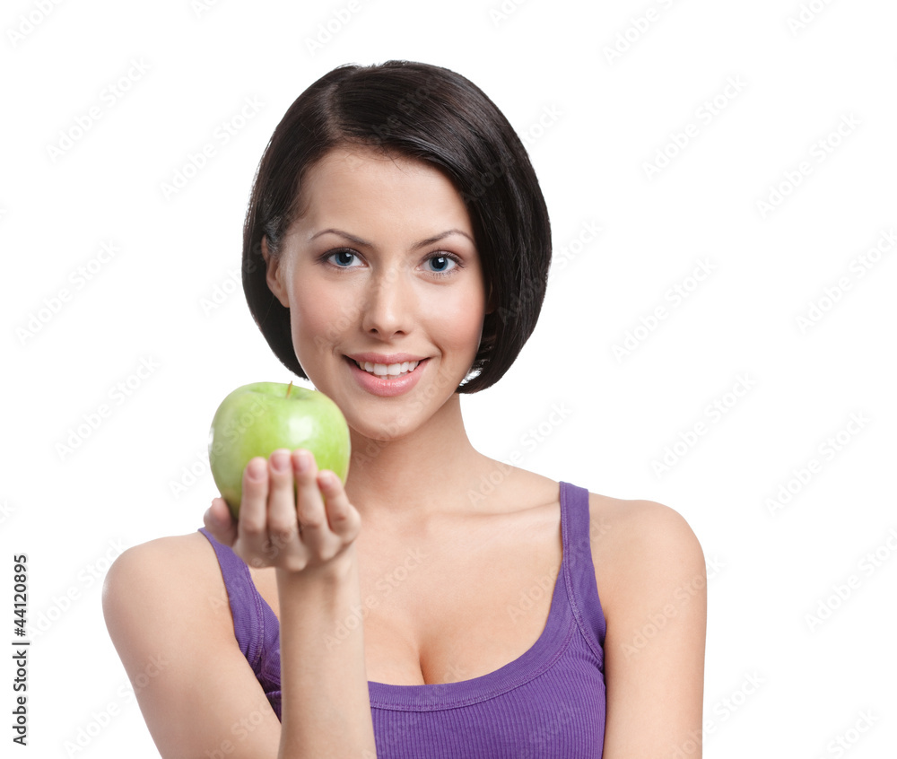 Young lady with green apple, white background Young lady with green apple, white background