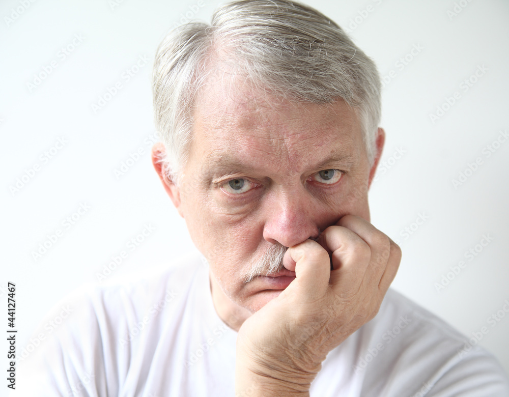 senior man looking very bored senior man looking very bored