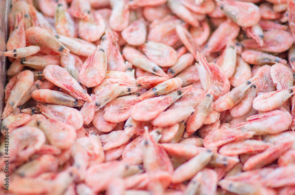 Bunch of fresh shrimps in fridge in supermarket