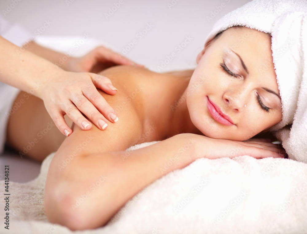 Closeup of an attractive young woman receiving massage Closeup of an attractive young woman receiving massage