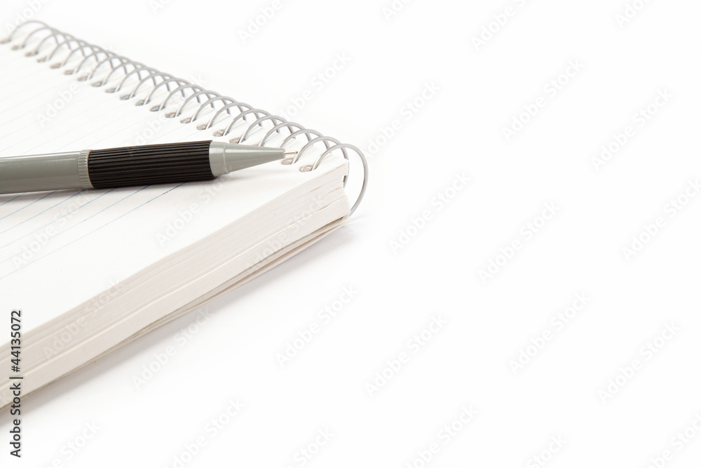 Office and school. Automatic pencil and notebook isolated on whi Office and school. Automatic pencil and notebook isolated on whi