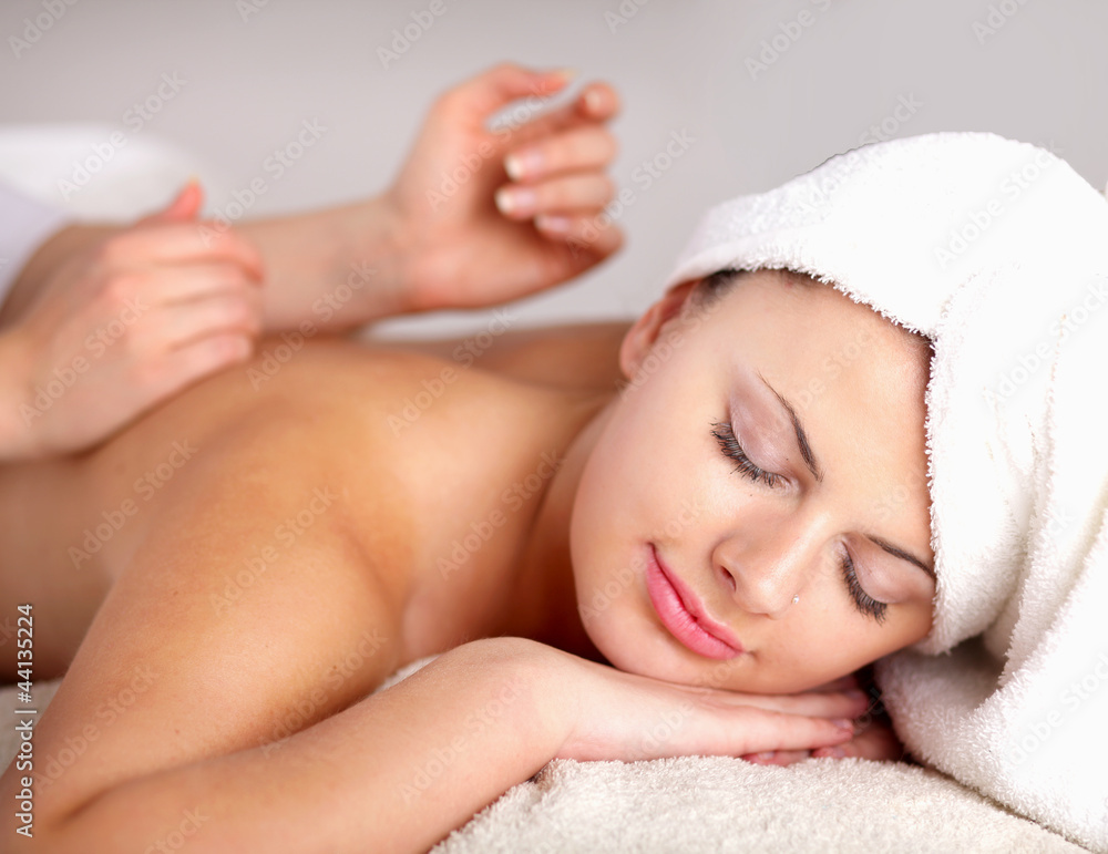 Closeup of an attractive young woman receiving massage Closeup of an attractive young woman receiving massage