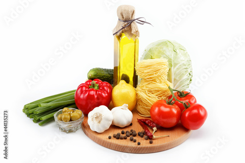 Fototapeta Naklejka Na Ścianę i Meble -  set fresh vegetables with olive oil isolated on white background