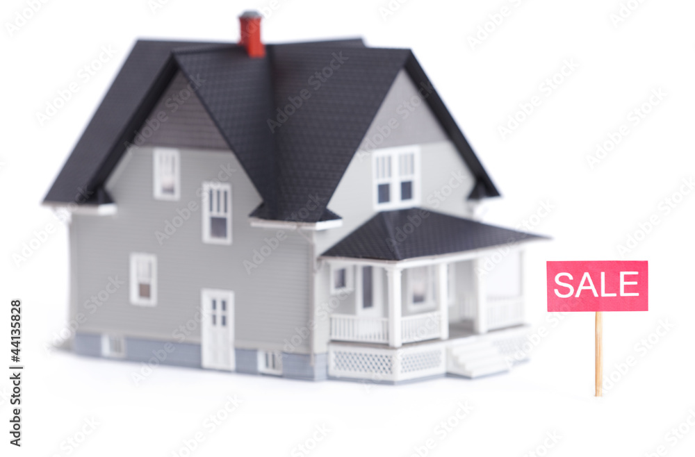 Household architectural model with sale sign, isolated on white Household architectural model with sale sign, isolated on white