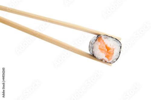 Sushi roll with chopsticks, isolated on white background