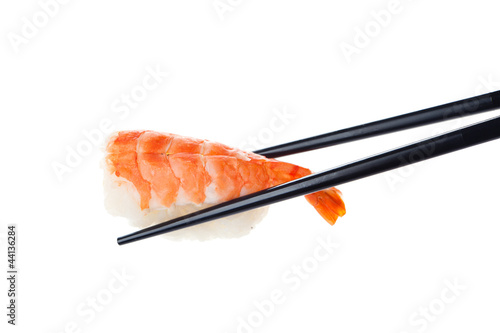 Sushi nigiri with chopsticks, isolated