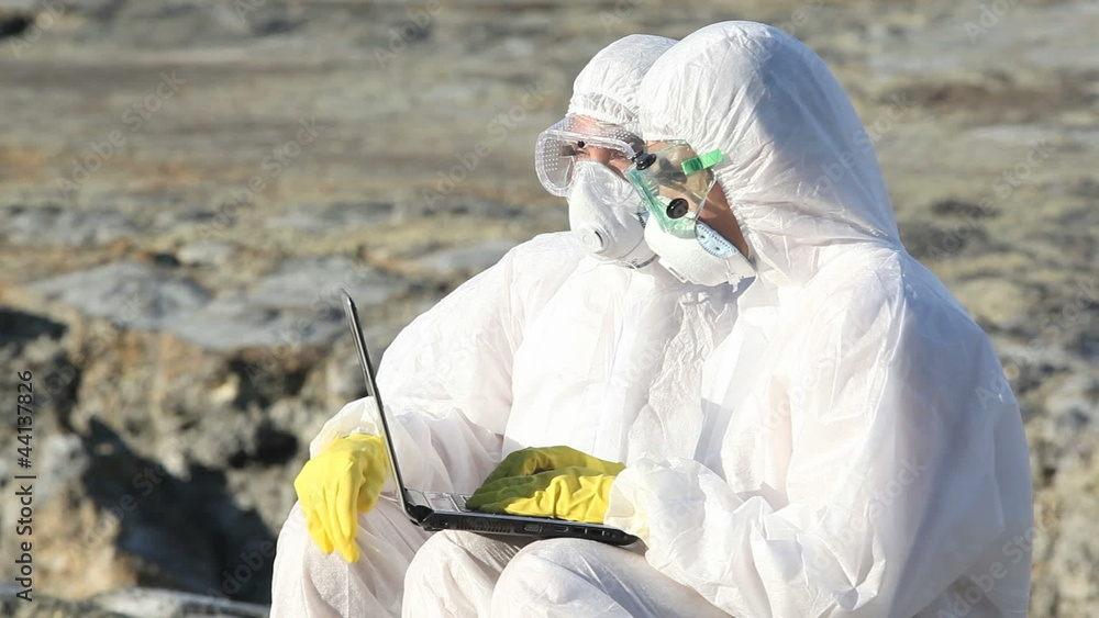 Ecology professionals typing on laptop report of environmen