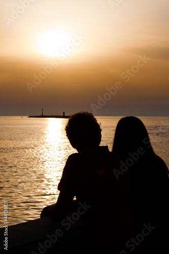 Young Couple Silhouette at Sunset