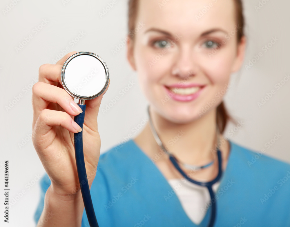 Closeup portrait of a pretty nurse with a stethoscope. Closeup portrait of a pretty nurse with a stethoscope.