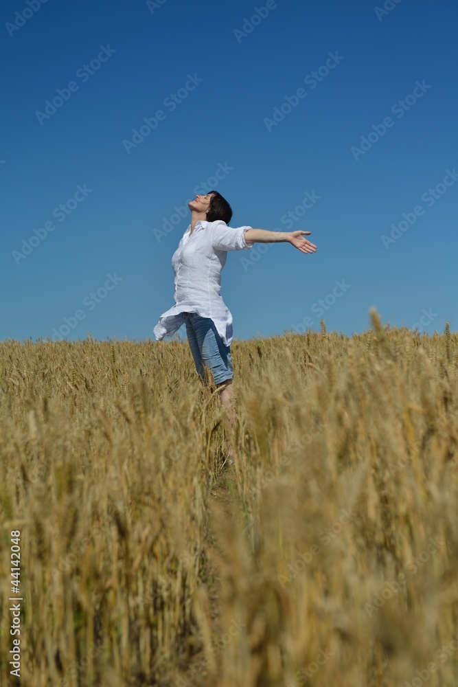 young woman in wheat field at summer young woman in wheat field at summer