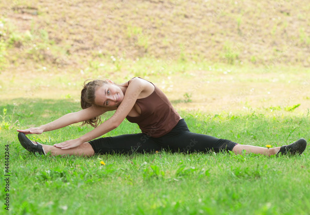 Woman doing sports stretching exercise
