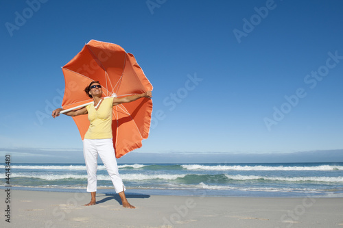 Pretty mature woman ocean background