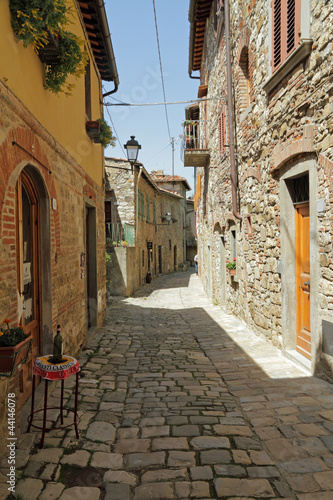 narrow stony street in tuscan borgo Montefioralle