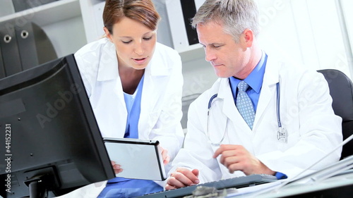 Wallpaper Mural Doctors Checking Patient Information Wireless Tablet Torontodigital.ca