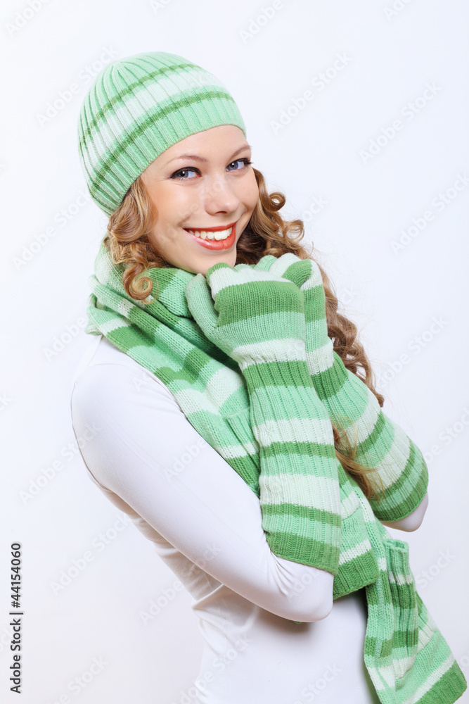 Young woman wearing winter hat and warm scarf Young woman wearing winter hat and warm scarf