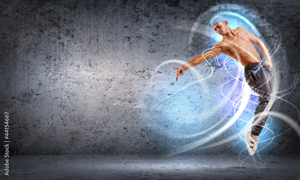 Fototapeta premium young man dancing hip hop with color lines