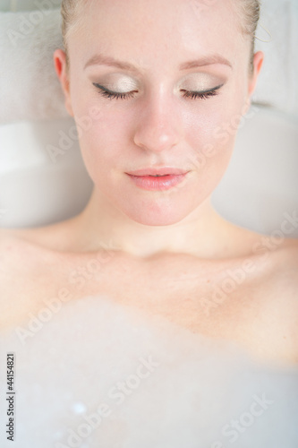 Bath woman enjoying bahub. Naturaly beautiful female relaxing