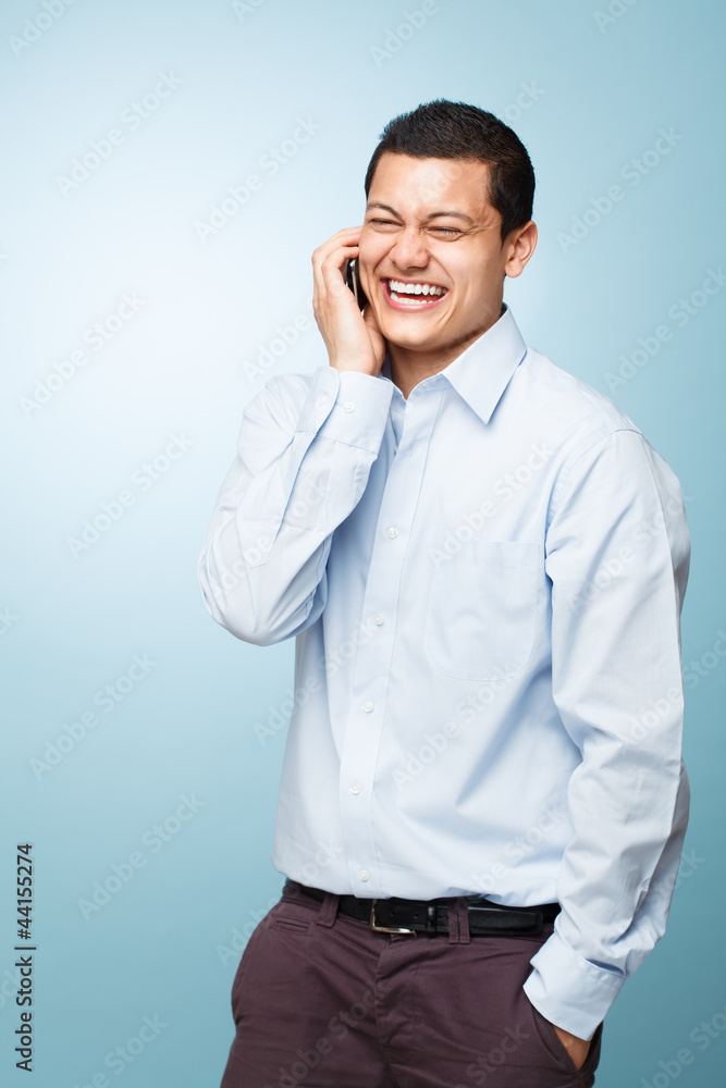 Happy young man holding mobile phone Happy young man holding mobile phone