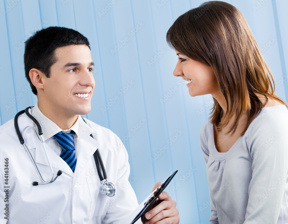 Portrait of smiling doctor and female patient Portrait of smiling doctor and female patient