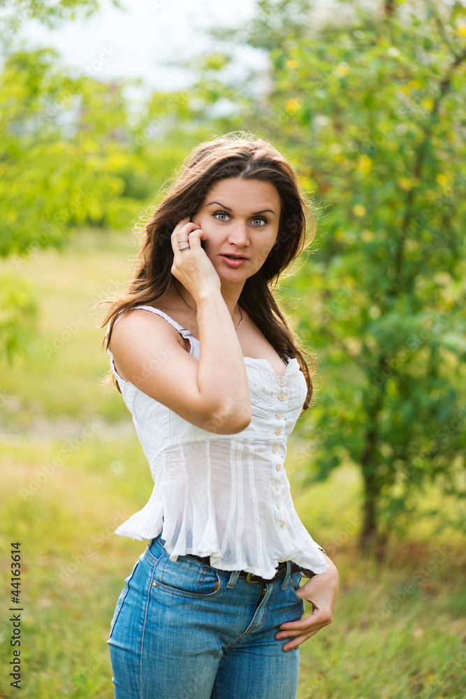 Outdoor portrait of young woman with phone Outdoor portrait of young woman with phone