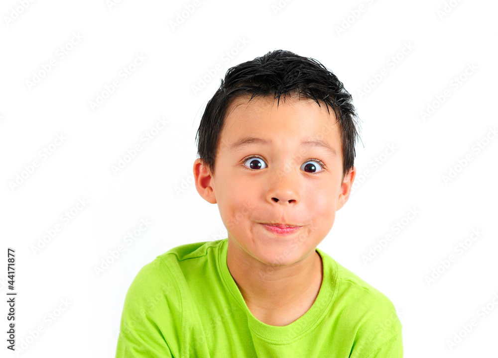Boy in Green T-shirt with Cute Expression on White Background Boy in Green T-shirt with Cute Expression on White Background
