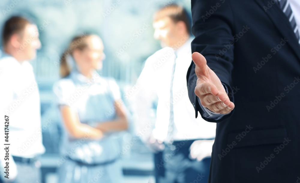 A business man with an open hand ready to seal a deal A business man with an open hand ready to seal a deal