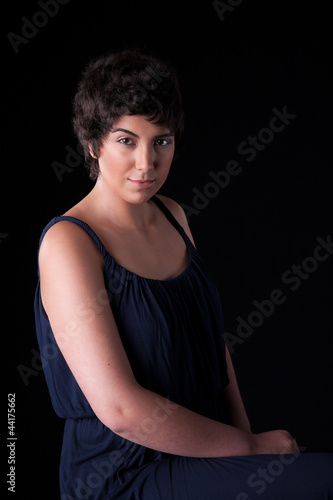 portrait of a beautiful young woman, on black, studio shot