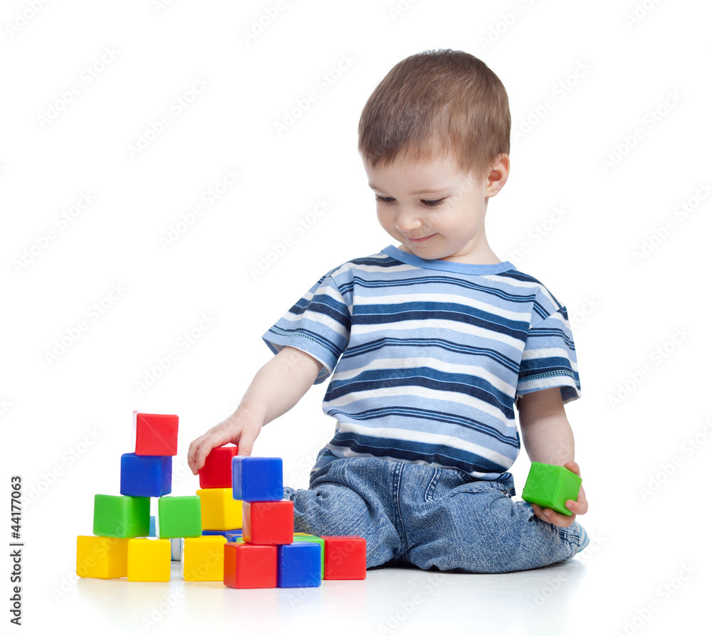 cheerful kid boy with construction set over white background cheerful kid boy with construction set over white background