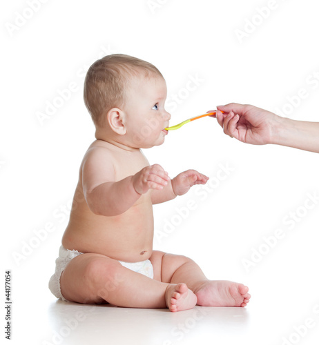 Little baby feeding with a ...