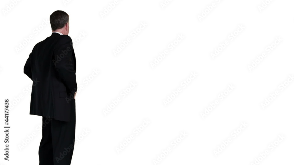 Isolated businessman turns to camera and smiles Isolated businessman turns to camera and smiles