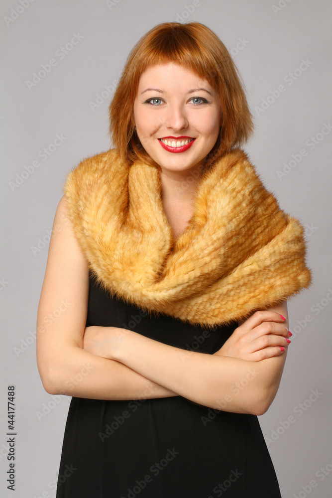 Portrait of a beautiful smiling woman with a fur scarf Portrait of a beautiful smiling woman with a fur scarf