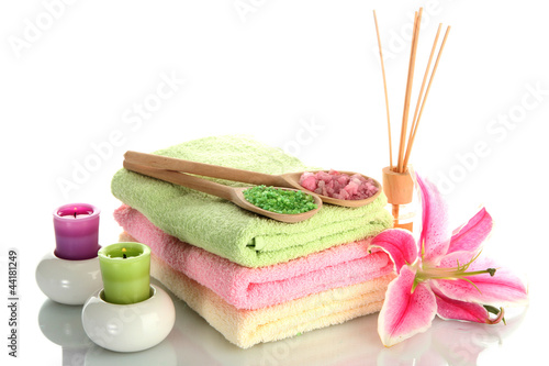 Fototapeta Naklejka Na Ścianę i Meble -  towels with lily, aroma oil,  candles and sea salt isolated