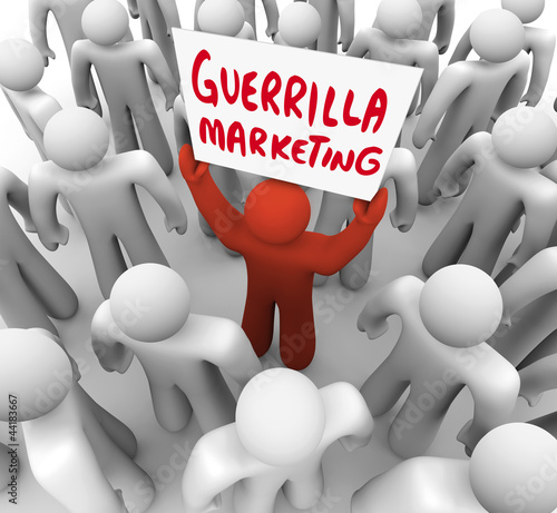Bild auf Leinwand Guerrilla Marketing Man Holding Sign Advertising Tactics