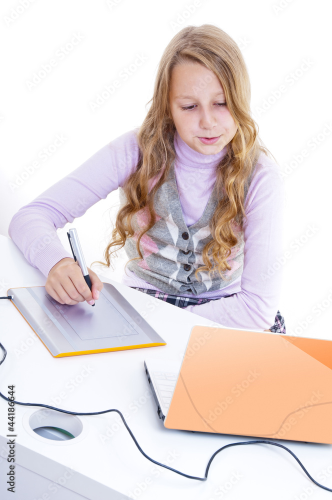 The schoolgirl painting with the digitizer and netbook The schoolgirl painting with the digitizer and netbook
