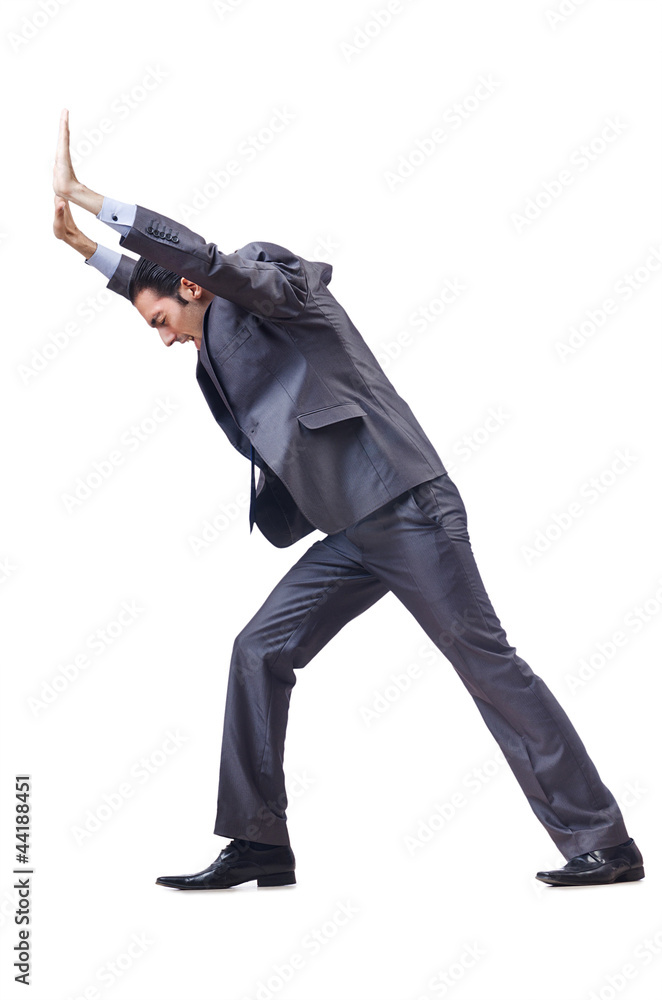 Young businessman pushing invisible obstacles Young businessman pushing invisible obstacles