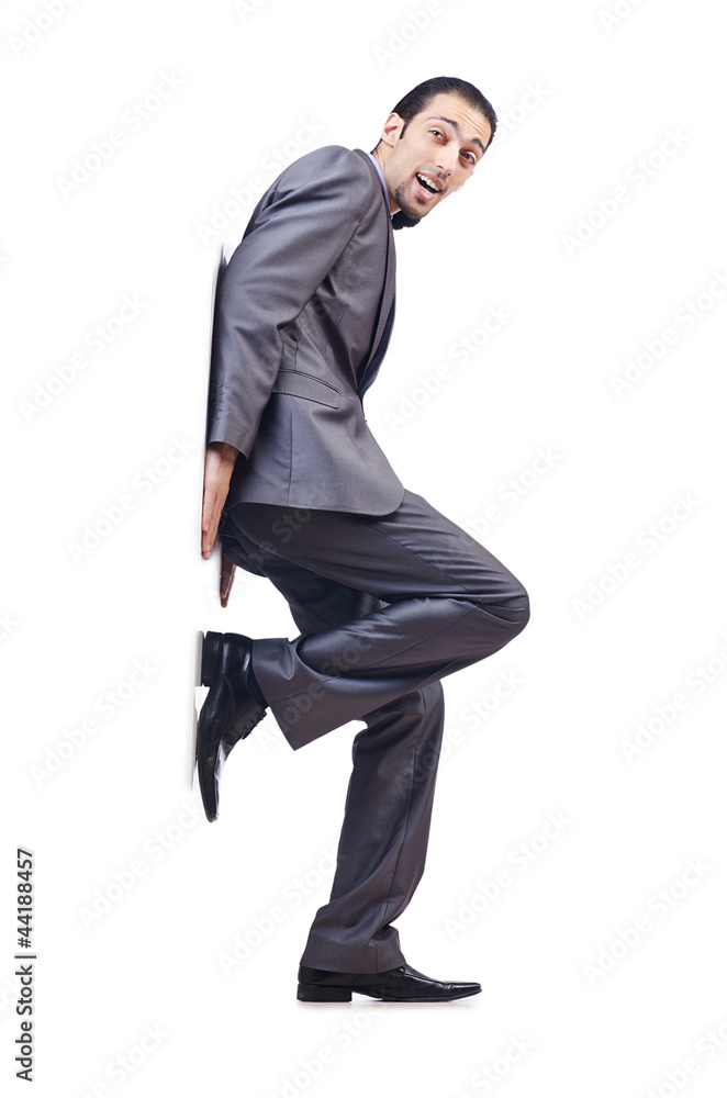 Young businessman pushing invisible obstacles Young businessman pushing invisible obstacles