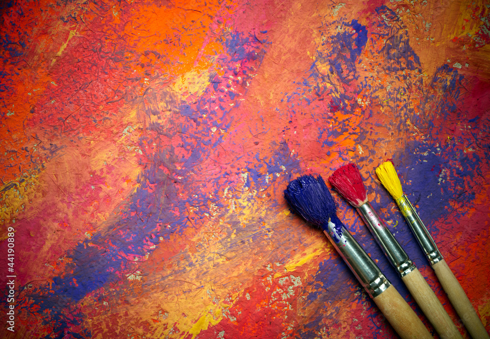 Obraz premium Paintbrushes on abstract grange background