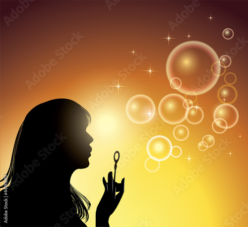 Girl making soap bubbles