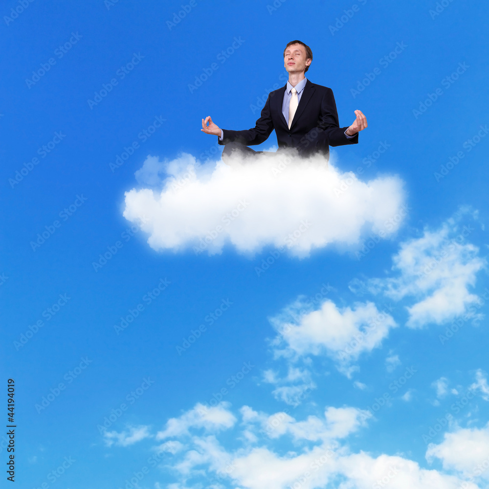 Businessman meditating sitting on the cloud Businessman meditating sitting on the cloud