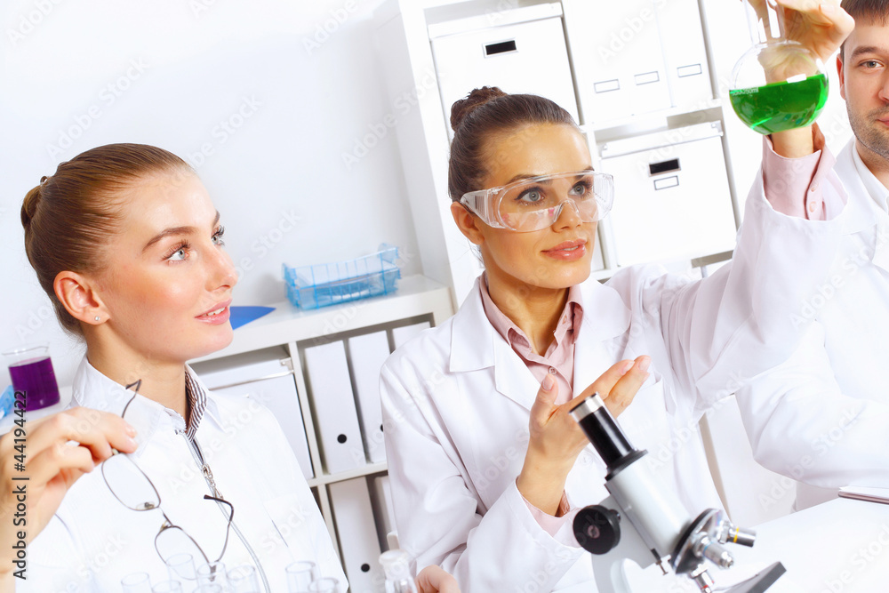Team of scientists working in laboratory Team of scientists working in laboratory