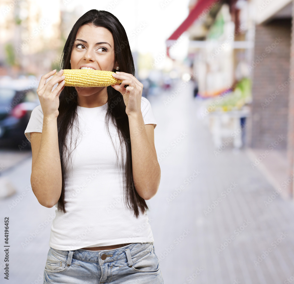 woman eating a corncob