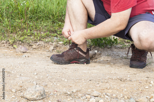 Man tied shoe laces on the trail