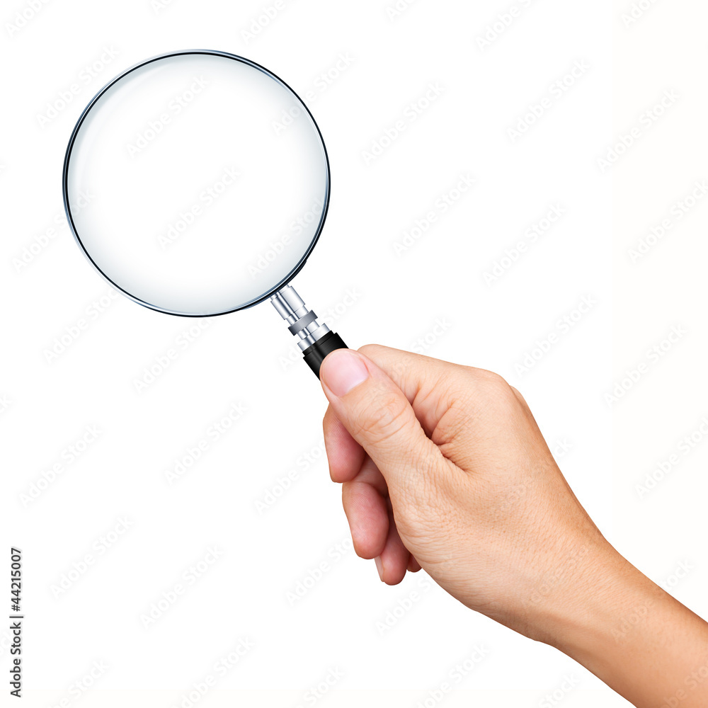 Obraz premium Hand holding magnifying glass isolated on white background