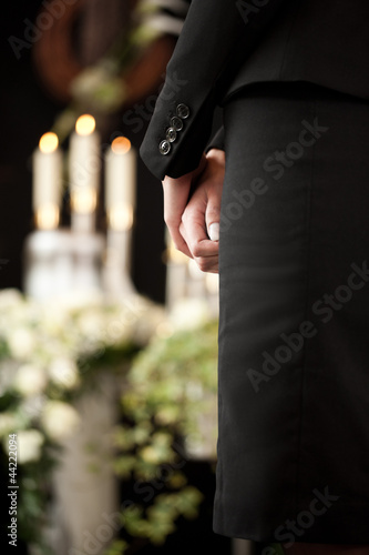 woman at funeral mourning