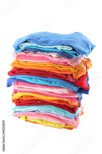 Pile of multiple color cloths on white background.