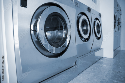 industrial washing machines in Commercial Laundromat photo