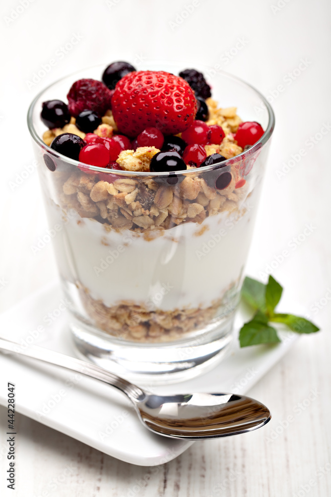 yogurt with muesli and berries in small glass yogurt with muesli and berries in small glass
